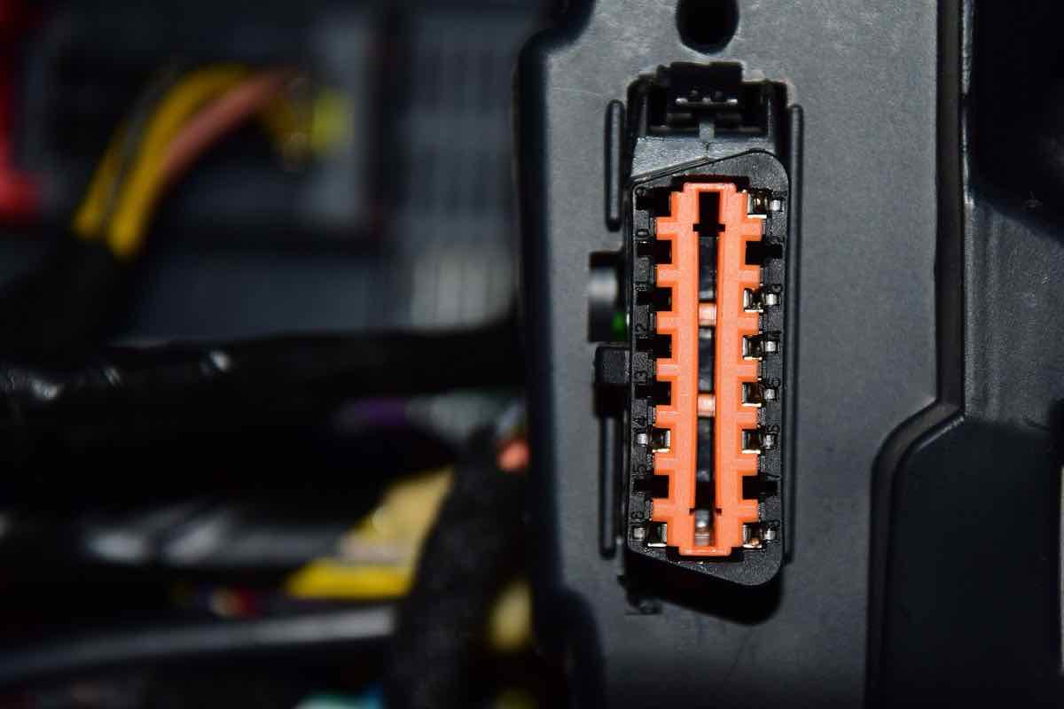 OBD-II diagnostic connector under a car dashboard