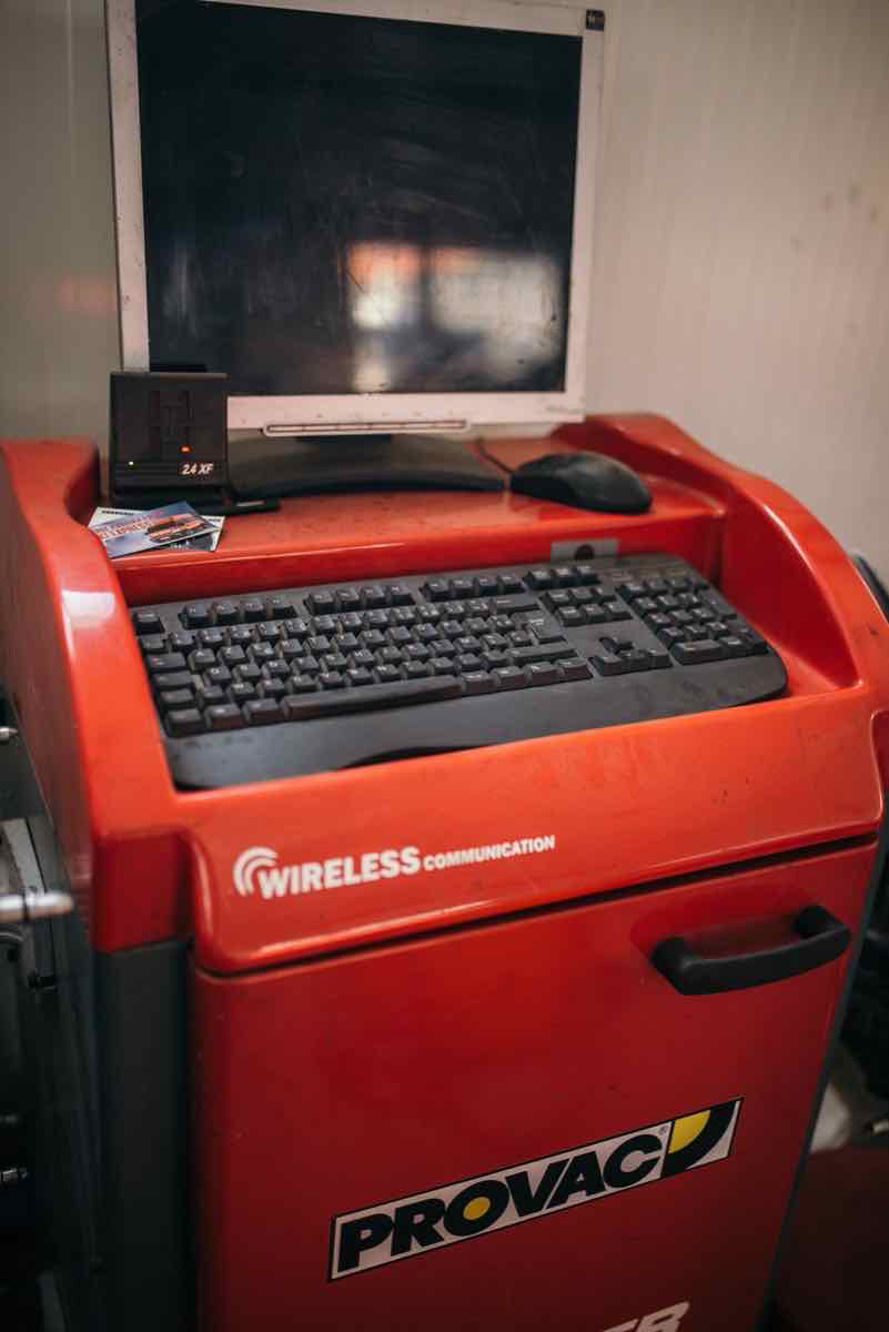 Wheel balancing machine at a tire service shop